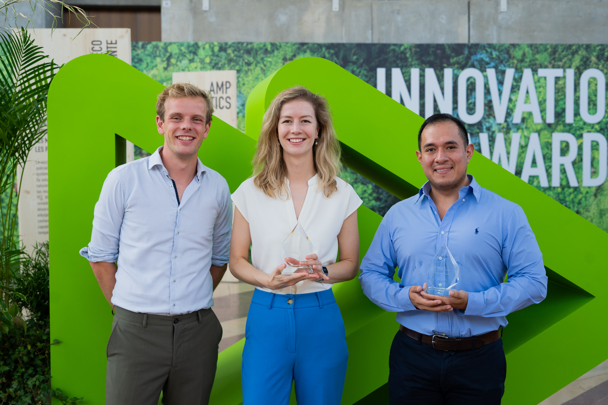 RELX Environmental Challenge winners standing in front of Pollutec logo with trophies