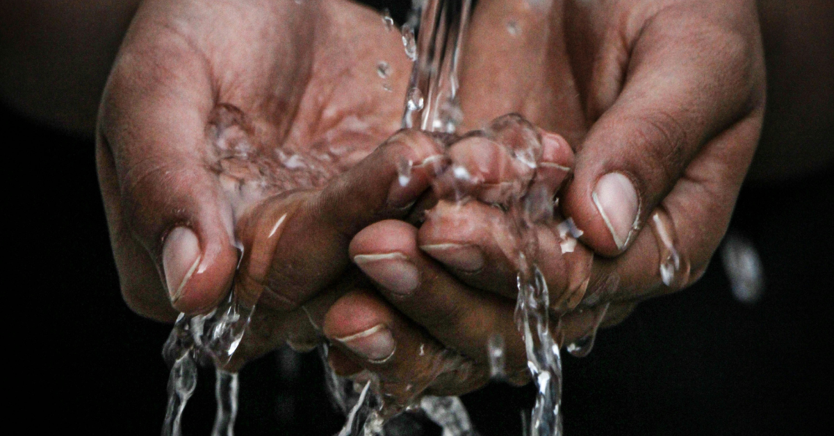 Hands splashing in water